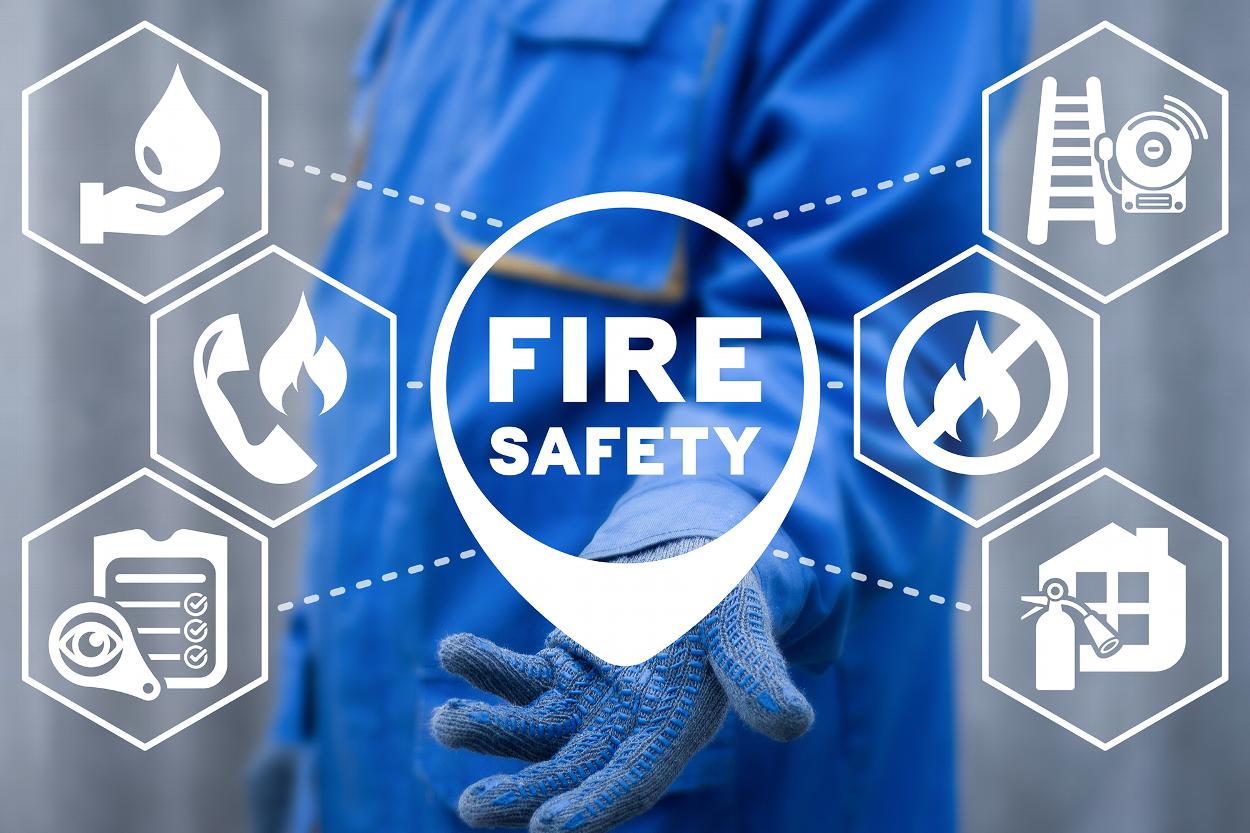 Concept gloved hand fire safety symbols